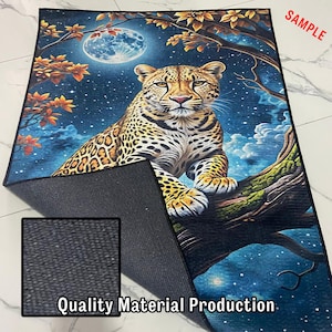 May include: A rectangular rug featuring a detailed illustration of a leopard resting on a tree branch under a full moon. The rug has a dark blue background with a starry night sky and autumn-colored leaves. The text "Quality Material Production" is visible.
