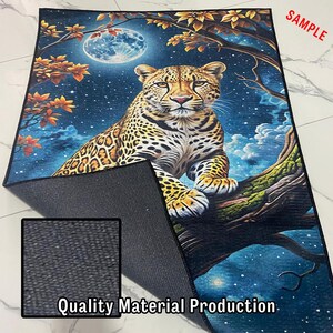May include: A rectangular rug featuring a detailed illustration of a leopard resting on a tree branch under a full moon. The rug has a dark blue background with a starry night sky and autumn-colored leaves. The text "Quality Material Production" is visible.