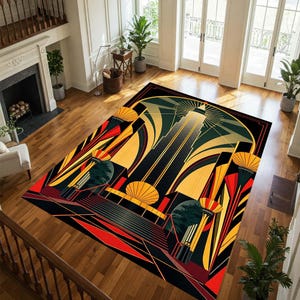May include: Art Deco style area rug with a geometric design in black, gold, red, and green. The rug features a central skyscraper motif with radiating lines and stylized architectural elements. The rug is rectangular and placed on a hardwood floor.