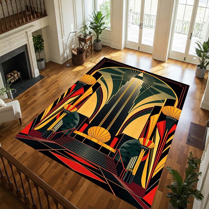 May include: Art Deco style area rug with a geometric design in black, gold, red, and green. The rug features a central skyscraper motif with radiating lines and stylized architectural elements. The rug is rectangular and placed on a hardwood floor.