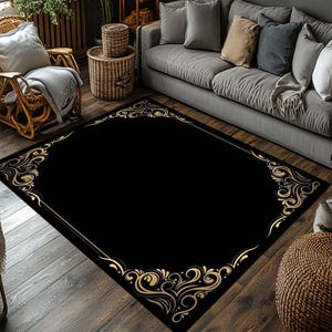 May include: A black and gold area rug with a decorative ornate border. The rug has a black background with a gold floral pattern.