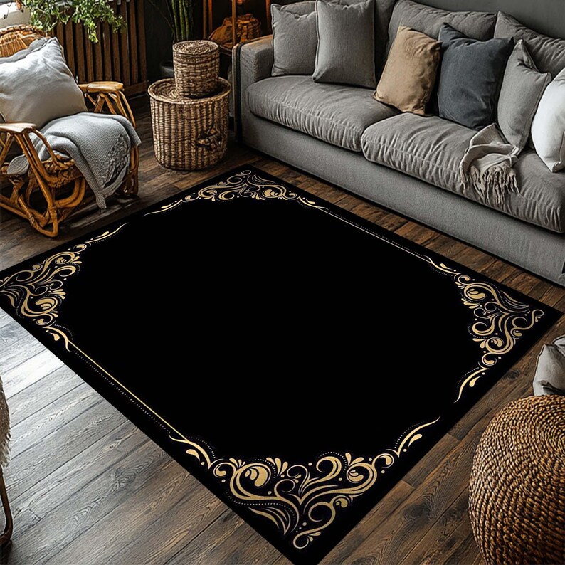 May include: A black and gold area rug with a decorative ornate border. The rug has a black background with a gold floral pattern.