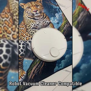May include: A white robot vacuum cleaner sits on a rug with a leopard design. The rug features a detailed illustration of a leopard perched on a tree branch. The text "Robot Vacuum Cleaner Compatible" is visible at the bottom.