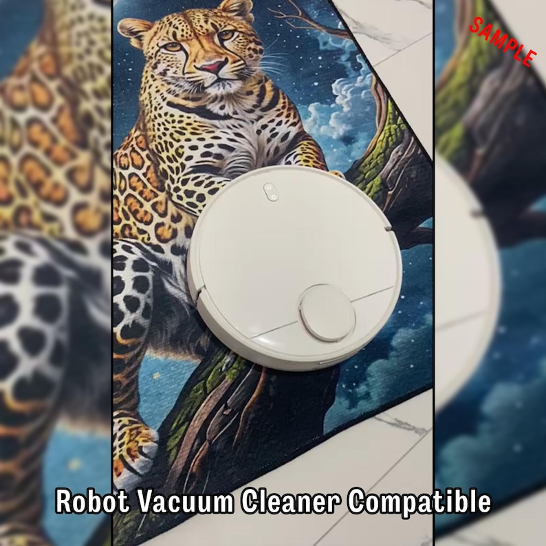 May include: A white robot vacuum cleaner sits on a rug with a leopard design. The rug features a detailed illustration of a leopard perched on a tree branch. The text "Robot Vacuum Cleaner Compatible" is visible at the bottom.