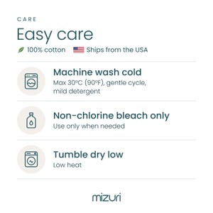 Care card for the Leopard cotton blanket: machine wash cold up to 30°C (90°F) on a gentle cycle with mild detergent, non-chlorine bleach only, tumble dry low.
