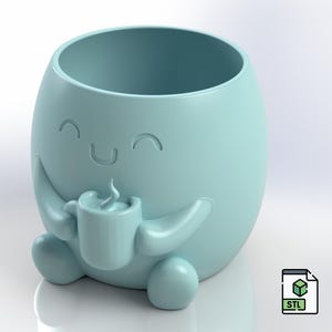 May include: A light blue ceramic planter shaped like a smiling character holding a cup of coffee. The planter has a wide opening for planting.
