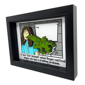 May include: A framed 3D illustration of a woman vomiting green liquid into a toilet bowl. The caption reads "It was that moment when Regan realized maybe she had a drinking problem."