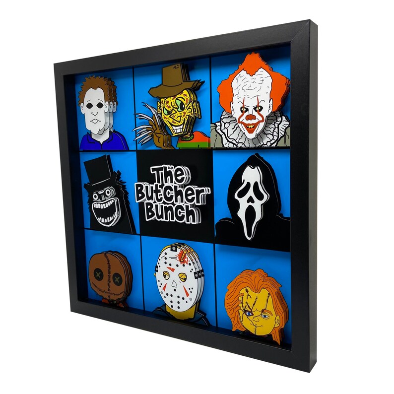May include: A black framed shadow box with a blue background and nine different horror movie character cutouts. The characters include Jason Voorhees, Freddy Krueger, Michael Myers, Leatherface, Chucky, Ghostface, and more. The title "The Butcher Bunch" is printed in black and white on the box.