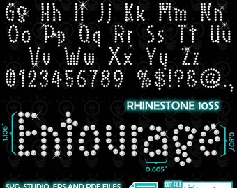 May include: A black graphic featuring an alphabet, numbers, and symbols, all designed with sparkling rhinestones. The word "Entourage" is also spelled out in rhinestones. The image includes measurements of 2.79 cm and 2.05 cm.