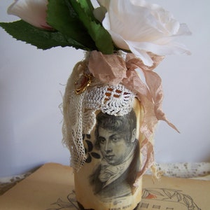 collage art-altered vintage bottle-amber glass- re-purposed bottle-flower vase-embellished with vintage finds- shelf sitter-desktop display