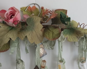 shabby chic, feminine wall decor, vintage perfume bottles, roses, silk ribbon, vintage photos, satin dress hanger