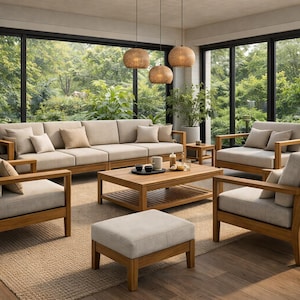 May include: A contemporary outdoor lounge set featuring a light beige sofa, armchairs, and a coffee table. The furniture has wooden frames and light beige cushions. The room has large windows with a view of lush greenery, and woven pendant lights.