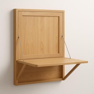 May include: A light oak wall-mounted desk with a drop-down work surface. The desk features a rectangular cabinet with a hinged door and a pull-down desk that is 24 inches wide. The desk is supported by a triangular bracket.