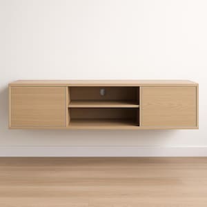 May include: A light-colored, wall-mounted entertainment center with two doors and open shelving. The unit is made of wood and has a simple, modern design. The doors are on the left and right sides, with open shelving in the center. The unit is approximately 72 inches wide.