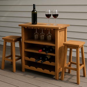 May include: A wooden wine bar with a bottle of wine, two wine glasses, and three hanging wine glasses. The bar has shelves for wine bottles and two matching stools. The bar and stools are made of light brown wood.