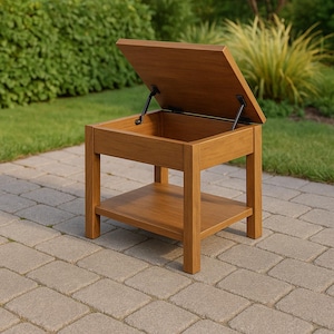 Puede incluir: Una mesa auxiliar de almacenamiento de madera con tapa abatible, abierta para revelar un interior vacío. La mesa tiene un estante inferior y está construida con madera de color marrón claro. La tapa se mantiene abierta con una bisagra negra.