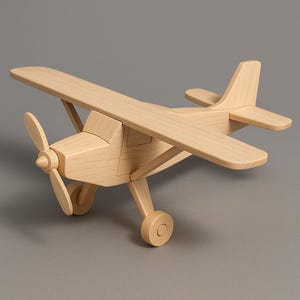 May include: A wooden toy aeroplane with a propeller, wings, and tail. The plane is made of light-coloured wood and has a classic design. The toy aeroplane has a wingspan of approximately 30 cm.