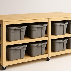 May include: A light wood storage unit with six grey plastic bins. The unit has two shelves and sits on four wheels. The bins are rectangular with a handle on the front. The unit is made of light-coloured wood.