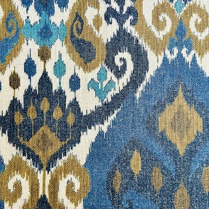 May include: Blue, brown, and white patterned fabric with an ikat design.