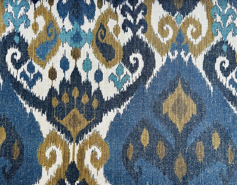 May include: Blue, brown, and white patterned fabric with an ikat design.