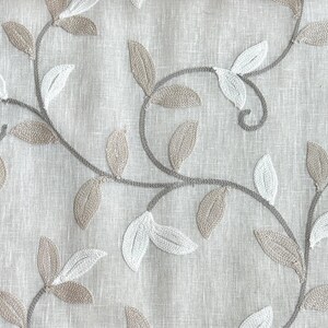 May include: Beige fabric with an embroidered design of brown and white leaves and vines.