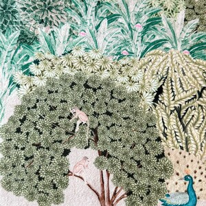 May include: A pink background with a green and brown tree with two monkeys in the branches. There is a peacock with blue and green feathers on the right side of the image. There are also small green plants and a brown deer with antlers.