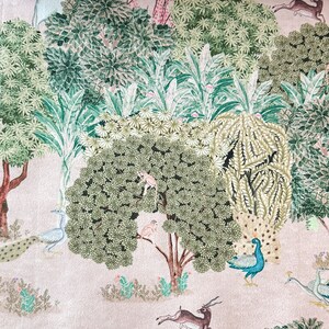 May include: A whimsical illustration of a forest scene with peacocks, monkeys, deer, and other animals. The background is a light pink color with green trees and foliage.
