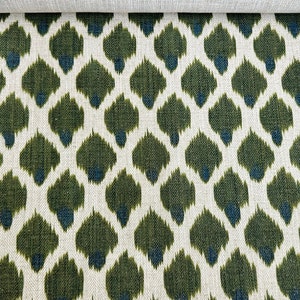 May include: Green and blue ikat fabric with a repeating pattern of teardrop shapes.