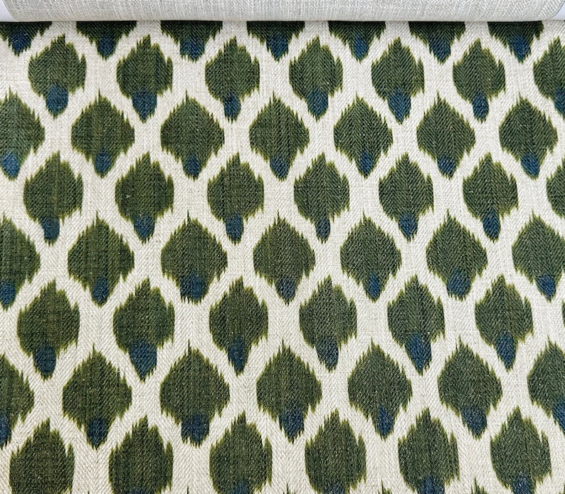 May include: Green and blue ikat fabric with a repeating pattern of teardrop shapes.