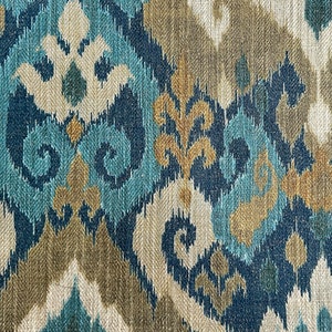May include: Blue, brown, and white ikat fabric with a repeating pattern of swirls and leaves.