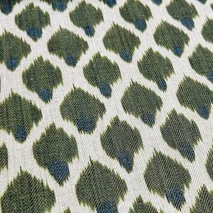 May include: Green and blue ikat fabric with a repeating pattern of abstract shapes.