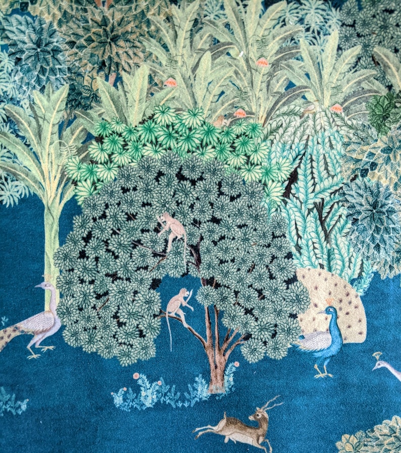 May include: A teal blue background with a large green tree in the center. The tree has two monkeys climbing on it. There are peacocks and a deer on the ground. The background is filled with green leaves and flowers.