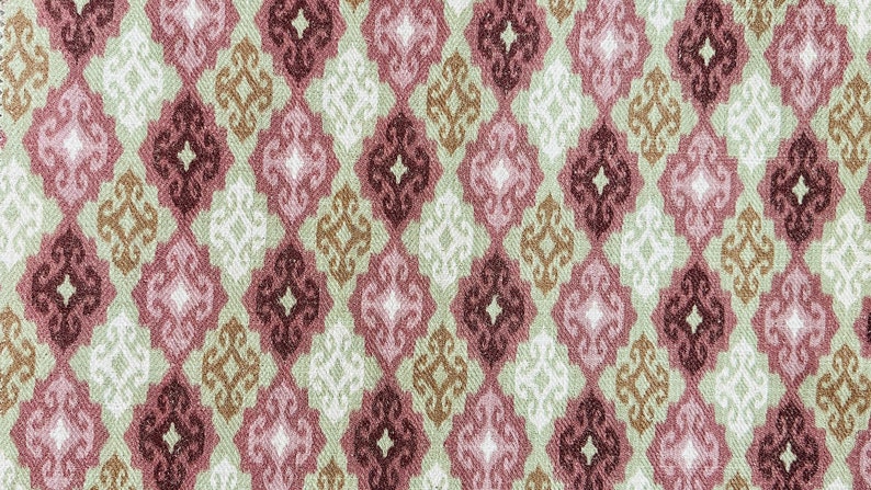 Puede incluir: Un patr&oacute;n sin costuras de formas geom&eacute;tricas repetidas en tonos de rosa, marr&oacute;n y blanco. El patr&oacute;n recuerda a un dise&ntilde;o textil tradicional.