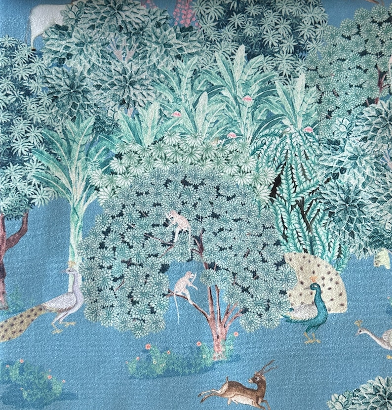 May include: A blue background with a green and white jungle scene. The scene includes peacocks, monkeys, deer, and birds.