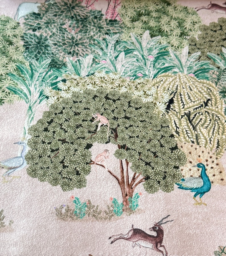 May include: A beige background with a green and brown tree in the center. Two small monkeys are climbing the tree. A peacock with blue and green feathers is standing on the right side of the image. A deer is jumping in the bottom right corner of the image.