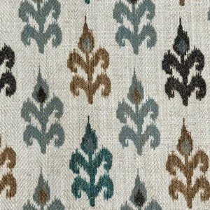 May include: A white fabric with a repeating pattern of blue, brown, and black stylized floral designs.