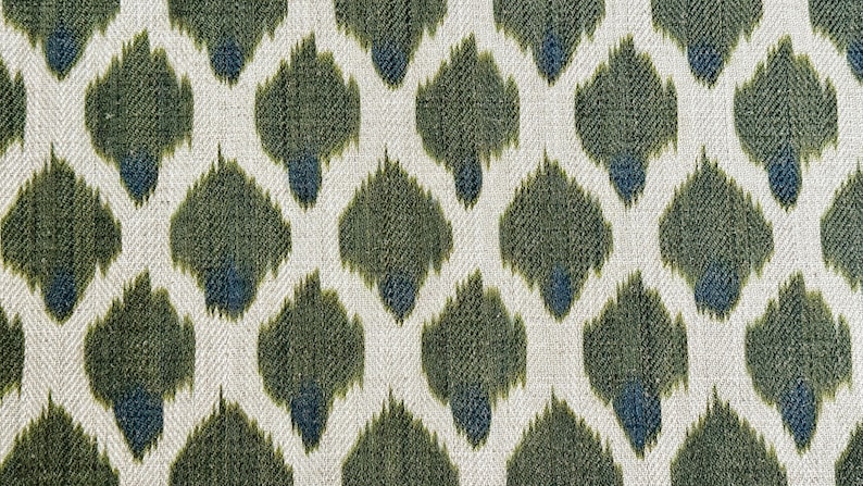 May include: Green and blue ikat fabric with a repeating pattern of teardrop shapes.
