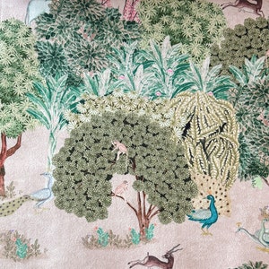 May include: A whimsical illustration of a forest scene with peacocks, monkeys, and deer. The background is a light pink with green trees and foliage.