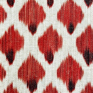 May include: Red and white ikat fabric with a repeating pattern of small, teardrop-shaped designs.