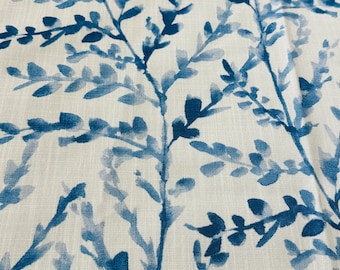 May include: Close-up of a fabric with a repeating pattern of blue watercolor-style branches and leaves against a white background. The design has a natural, organic feel, suitable for home decor or apparel.