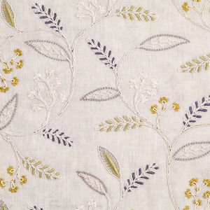 May include: White fabric with an embroidered floral pattern in shades of gray, green, and yellow. The design features delicate leaves and small flower clusters.