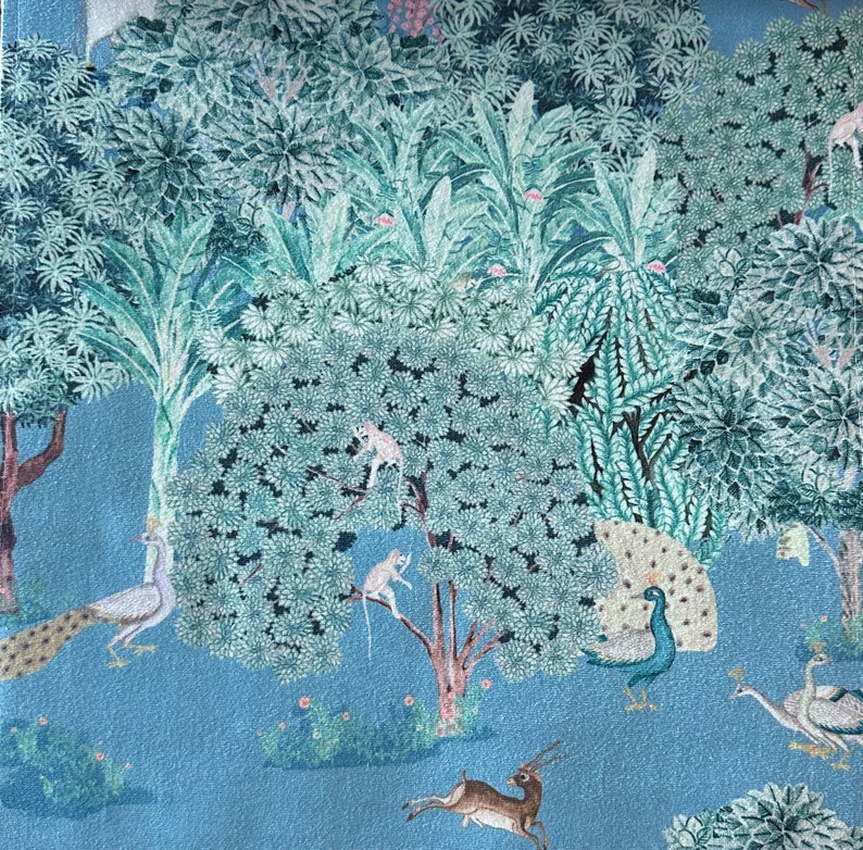 May include: A blue and green patterned fabric featuring a peacock, deer, and monkeys in a jungle setting.