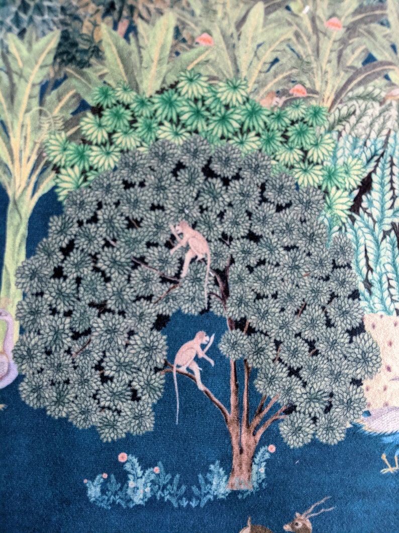 May include: A blue background with a large green tree with two pink monkeys in it. The tree has a brown trunk and branches. There are smaller green plants and flowers at the bottom of the image.