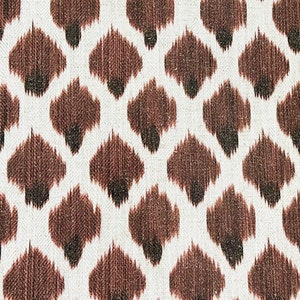 May include: Brown and white fabric with a repeating pattern of brown diamond shapes. The fabric has a textured, woven look.