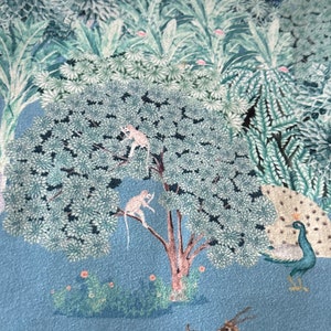 May include: A blue and green patterned fabric featuring a peacock, deer, and monkeys in a tree. The background is a light blue colour.
