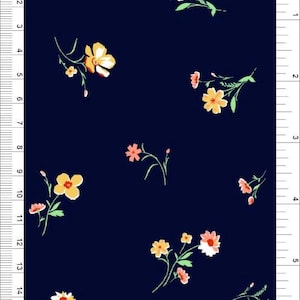 May include: Dark navy fabric with a repeating floral pattern. The flowers are yellow, orange, and pink with green stems. The design is scattered across the fabric, creating a delicate and feminine look.