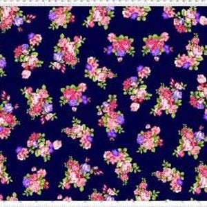 May include: A rectangular fabric with a navy blue background, adorned with clusters of pink, purple, and peach-colored flowers. The edges feature decorative borders with paisley patterns in purple, pink, and cream. A cream-colored stripe runs along the center.