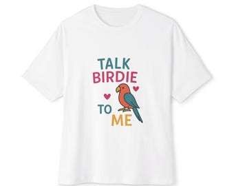May include: White t-shirt with a colorful graphic of a parrot and the text "TALK BIRDIE TO ME".