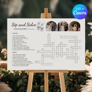 May include: A white wedding crossword puzzle titled "Sip and Solve" on a wooden easel. The puzzle includes photos, the names "SARAH & JAMES" and the date "12.03.2025". The text includes clues like "First name of the groom" and "Destination of their honeymoon".