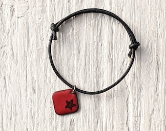 Flame Red Star Bracelet, Enamel Charm on Black Cord, Black Star on Red Charm Bracelet